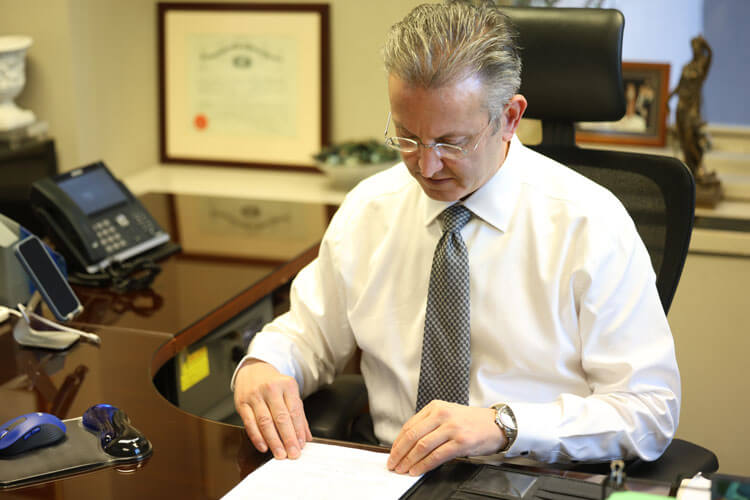 Jeffrey H. Penneys in office responding to dog bite insurance claims